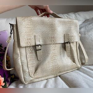 Debossed faux reptile messenger bag.